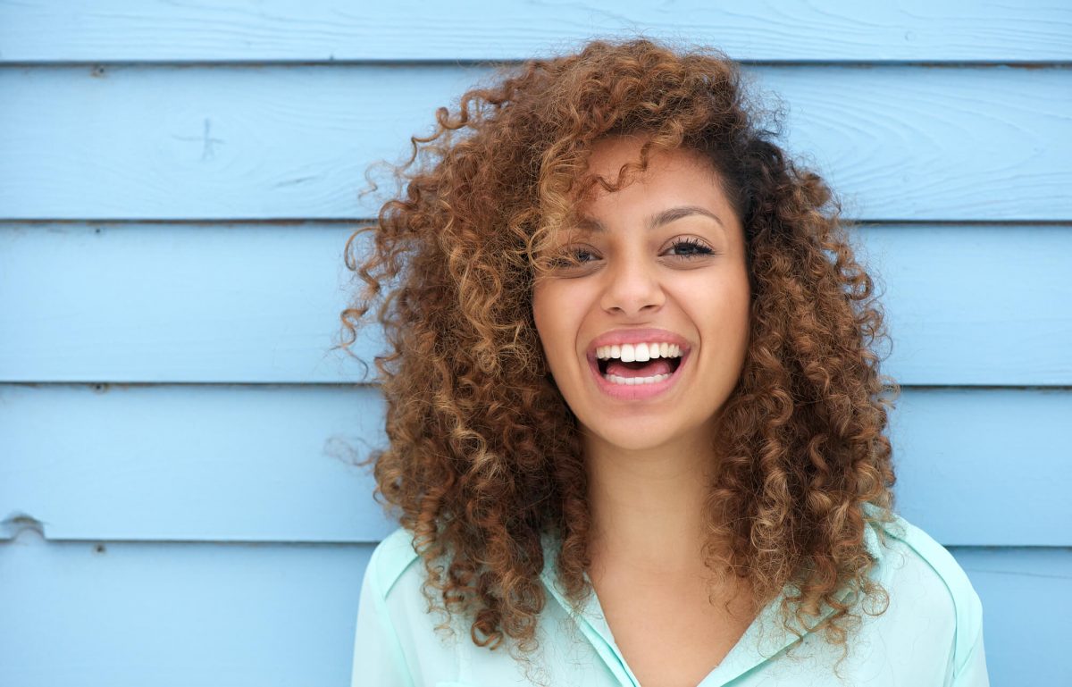 woman with healthy teeth because of family dentistry in Cary, North Carolina
